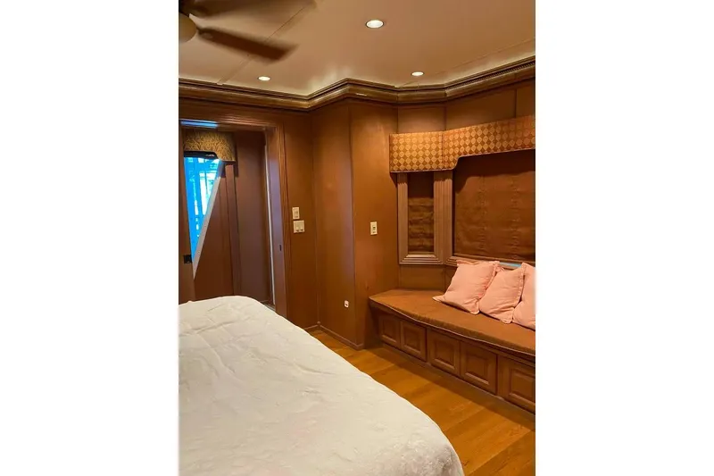 Slide: The Image of Summerset 21' x 106' houseboat, 2007 model, docked on a serene lake. - 189