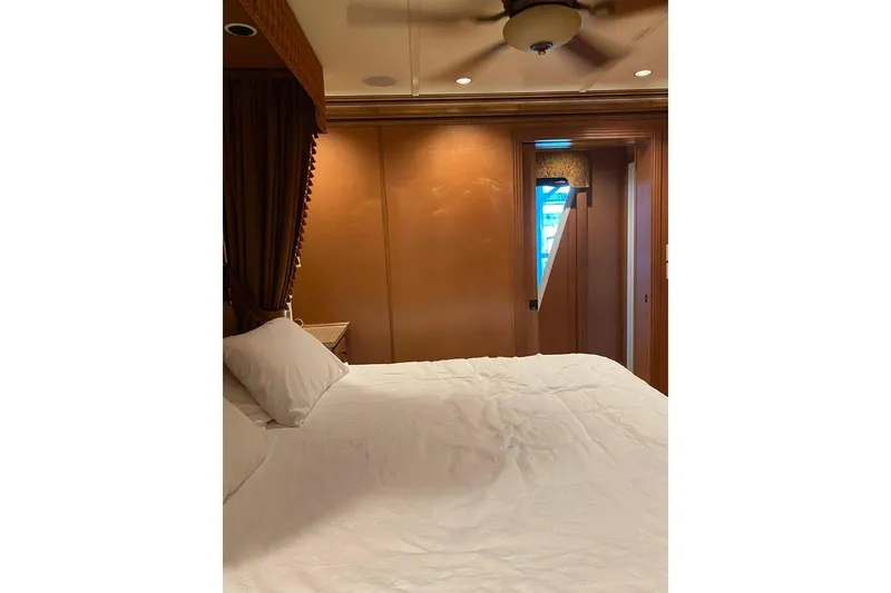 Slide: The Image of Luxurious interior of 2007 Summerset model with wood paneling, TV, and cozy seating area. - 194