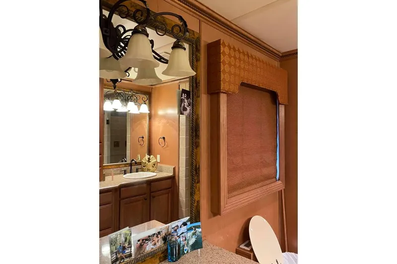 Slide: The Image of Luxurious bedroom with elegant drapes in a 2007 Summerset 21' x 106' model. - 196