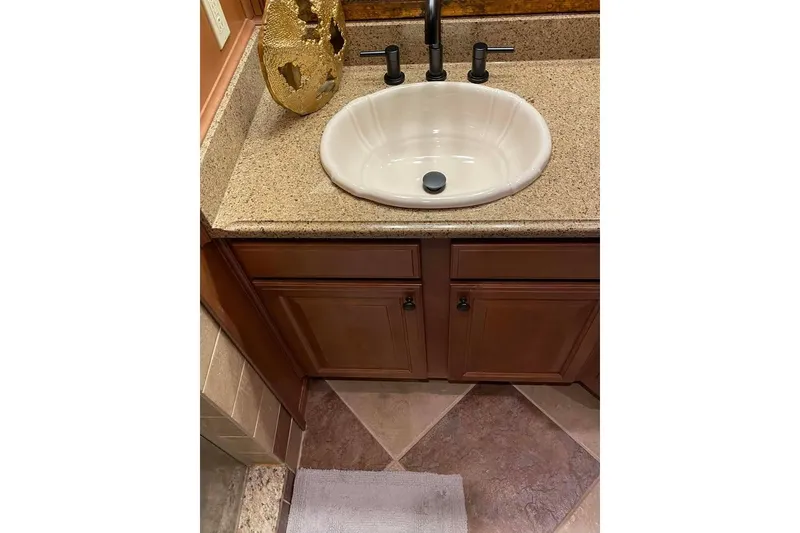 Slide: The Image of Luxurious bedroom interior in 2007 Summerset houseboat, featuring elegant wood paneling and cozy bedding. - 197