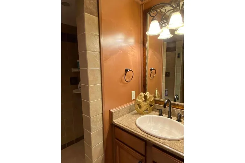 Slide: The Image of Elegant interior with ornate mirror and light fixture, Summerset 21' x 106', 2007 model. - 198