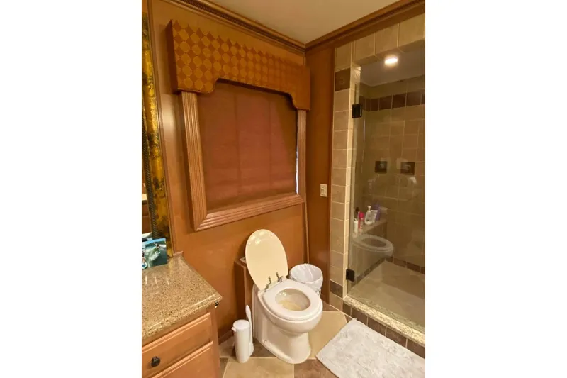 Slide: The Image of Wood-paneled wall with a lamp and decorative items, Summerset 21' x 106', 2007 model. - 203