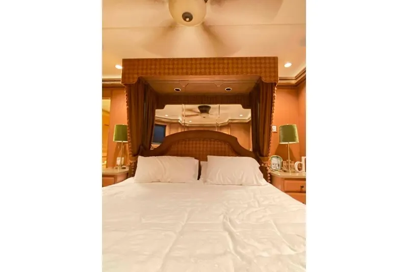 Slide: The Image of Luxurious bathroom vanity with ornate mirror and lighting in 2007 Summerset model. - 213