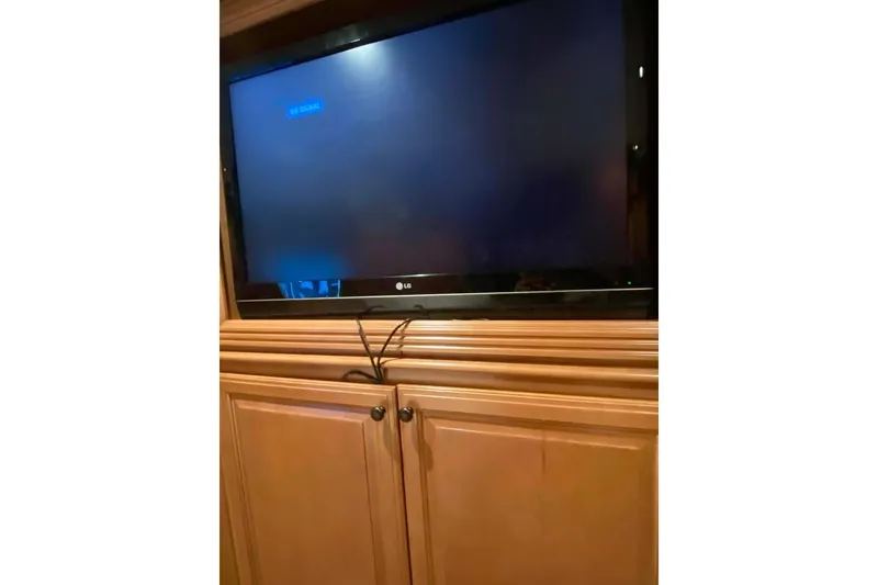 Slide: The Image of Luxurious bedroom interior in 2007 Summerset houseboat, featuring wood cabinetry and elegant decor. - 215