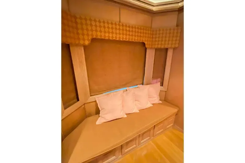 Slide: The Image of Wooden cabinet with granite countertop, featuring decorative items, in a Summerset 21' x 106' model, 2007. - 217