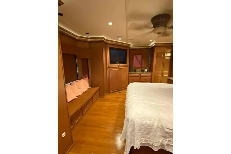 Slide: The Image of Luxurious bedroom interior in 2007 Summerset model, featuring elegant nightstand and lamp. - 219