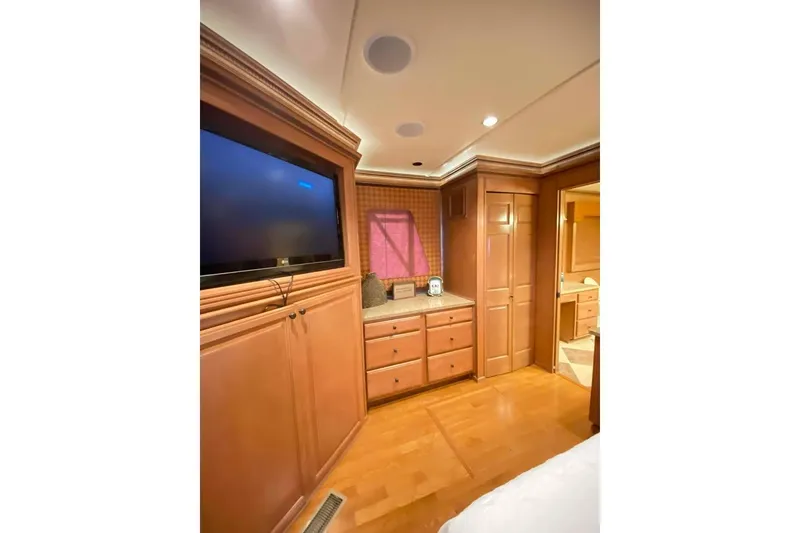 Slide: The Image of Luxurious bedroom interior of 2007 Summerset 21' x 106' houseboat with wood finishes. - 222