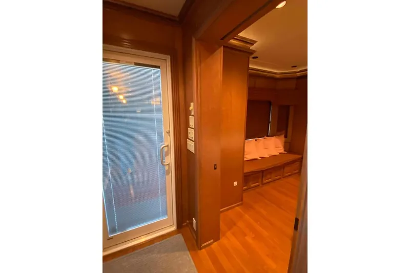 Slide: The Image of Luxurious interior of 2007 Summerset houseboat with wood cabinetry and flat-screen TV. - 225