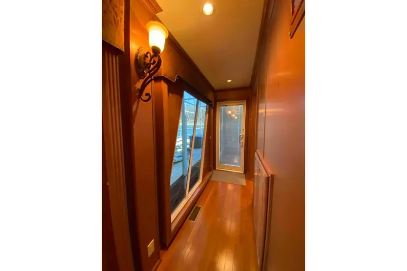 Slide: The Image of Cozy bedroom interior in 2007 Summerset model, featuring wooden cabinetry and bedside lamp. - 226