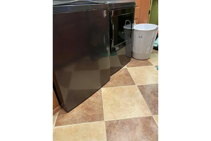 Slide: The Image of Interior of 2007 Summerset houseboat with wooden flooring and sliding glass door. - 228