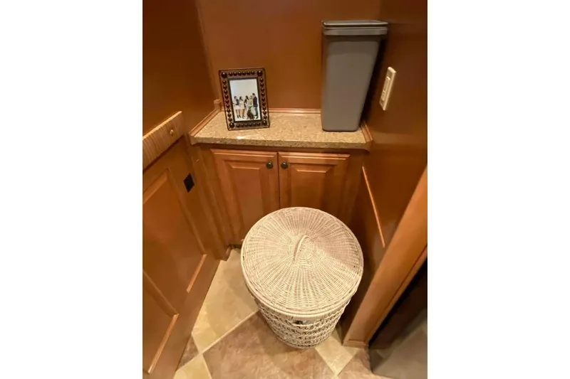 Slide: The Image of Laundry room with black appliances and a laundry basket on tiled floor. Summerset 21' x 106', 2007. - 231