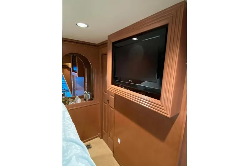 Slide: The Image of Cozy corner with wicker basket, framed photo, and trash bin on granite countertop. Summerset 2007. - 234