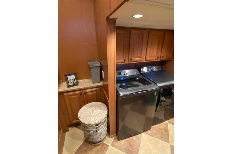 Slide: The Image of Wooden cabinetry with framed photo, Summerset 21' x 106', 2007 model interior detail. - 239