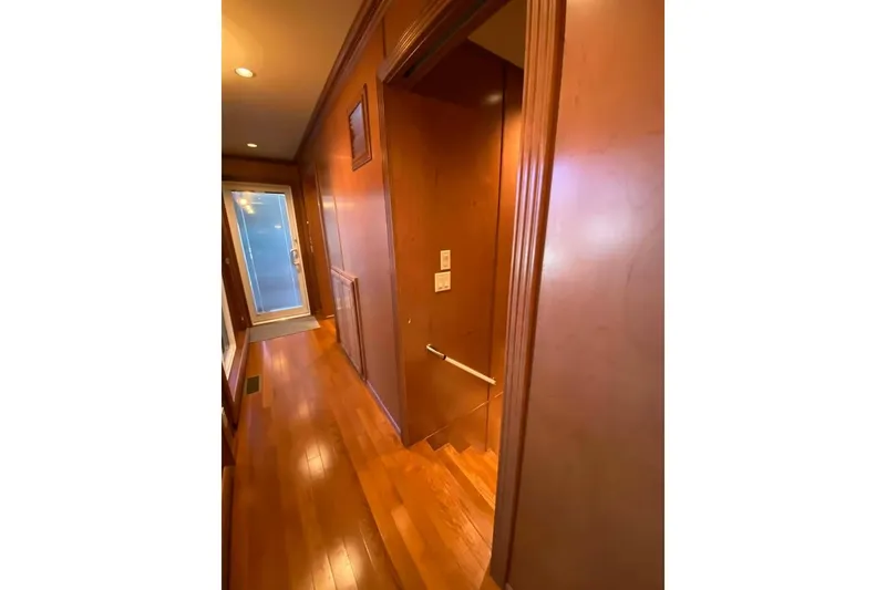 Slide: The Image of Laundry room with wooden cabinets and cleaning supplies on a granite countertop, Summerset 21' x 106', 2007. - 240