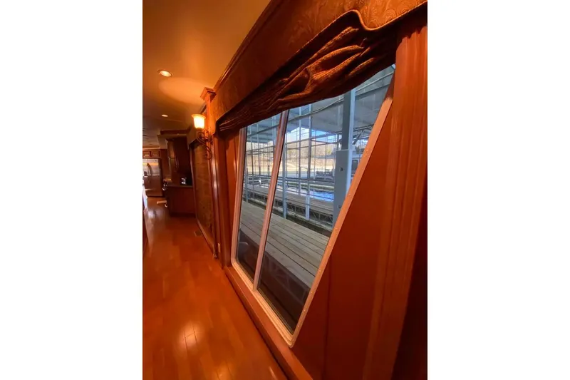 Slide: The Image of Laundry room with modern appliances, wooden cabinets, and a wicker basket. Summerset 21' x 106', 2007. - 242