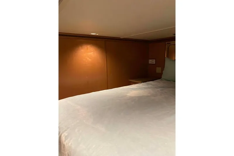 Slide: The Image of Luxurious hallway interior of 2007 Summerset houseboat, featuring wooden flooring and large windows. - 246