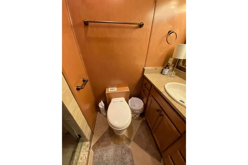 Slide: The Image of Interior of 2007 Summerset houseboat with wood paneling and wall-mounted TV. - 250