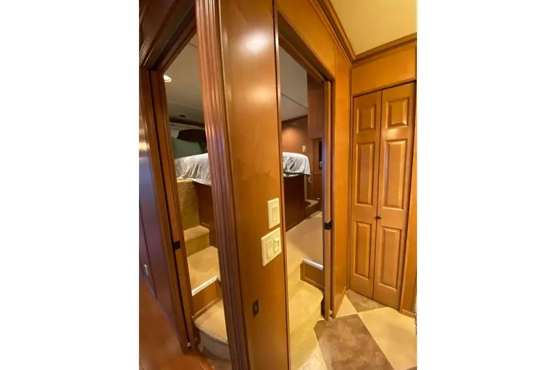 Slide: The Image of Cozy bedroom interior of 2007 Summerset 21' x 106' houseboat with elevated bed. - 251
