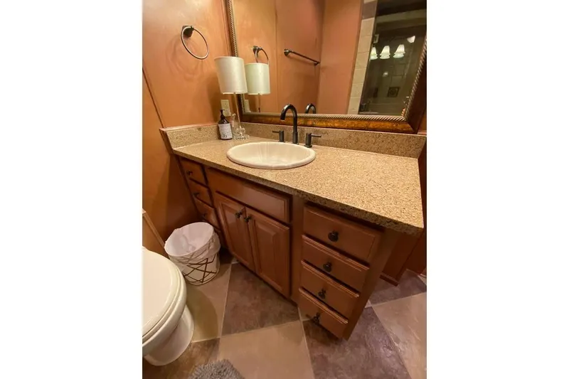 Slide: The Image of Interior of 2007 Summerset 21' x 106' houseboat with wooden finishes and cozy bedroom. - 254