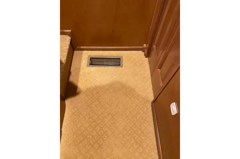 Slide: The Image of Interior view of 2007 Summerset houseboat with carpeted stairs and wooden walls. - 256