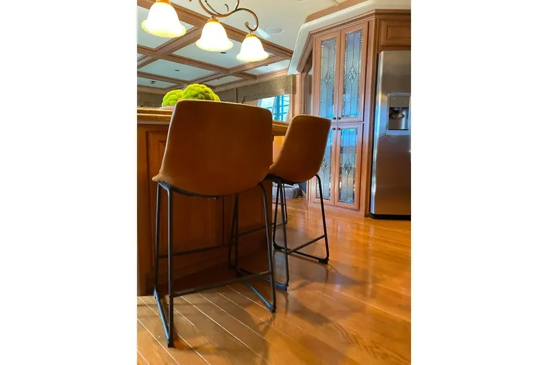 Slide: The Image of Luxurious leather seating area in a 2007 Summerset 21' x 106' model yacht. - 26