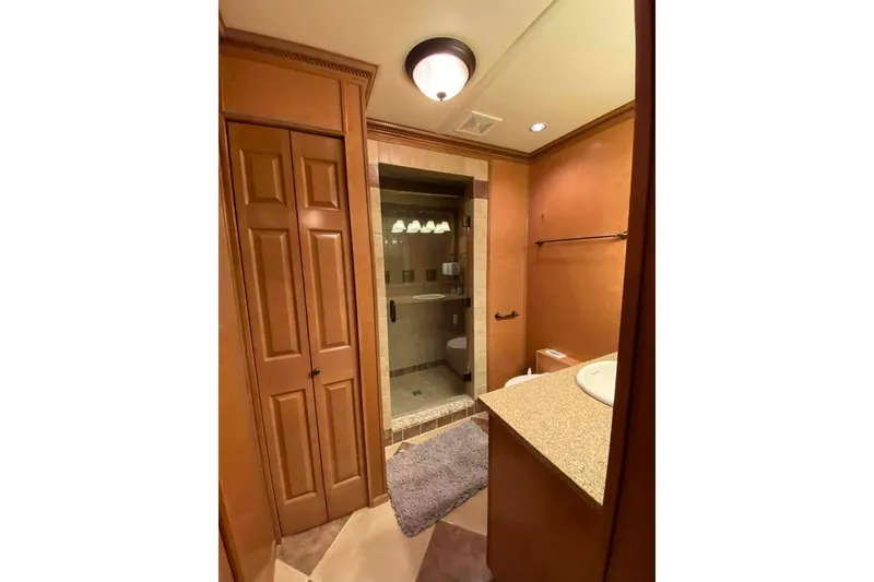 Slide: The Image of Wooden closet interior with wire shelving in a 2007 Summerset 21' x 106' model. - 261