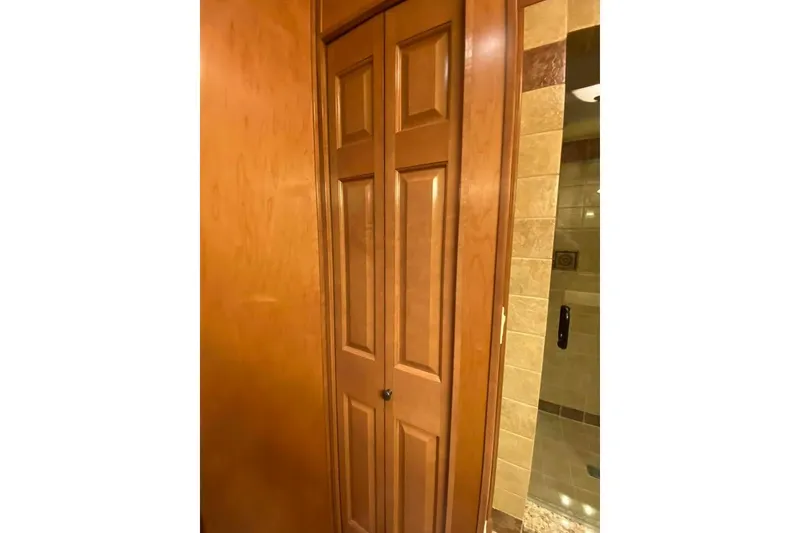 Slide: The Image of Tile shower corner with built-in shelves in a 2007 Summerset model. - 263