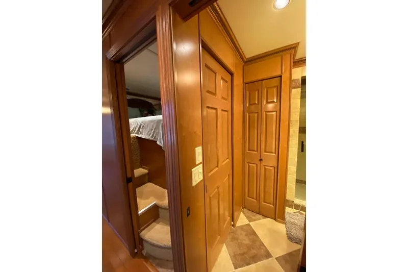 Slide: The Image of Luxurious bathroom in 2007 Summerset model, featuring wooden cabinetry and a glass-enclosed shower. - 264