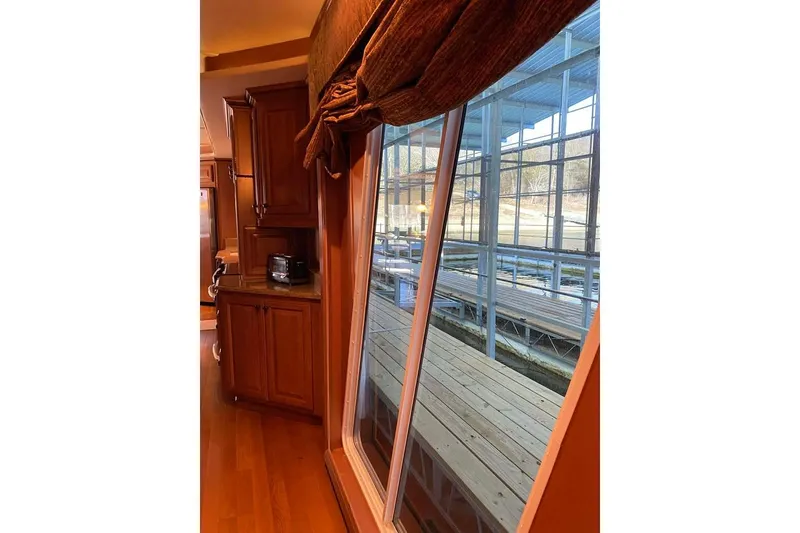 Slide: The Image of Luxurious 2007 Summerset houseboat interior with wooden cabinetry and modern bathroom. - 270