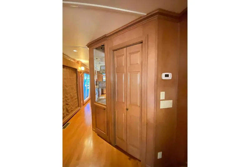 Slide: The Image of Wooden pantry with shelves inside a 2007 Summerset 21' x 106' model. - 274