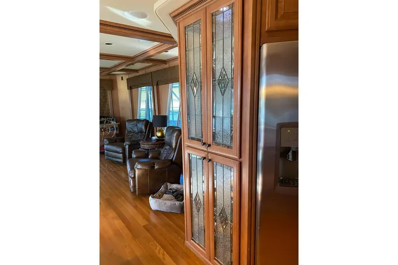 Slide: The Image of Luxurious kitchen interior of 2007 Summerset houseboat with elegant cabinetry and decorative glass panel. - 28