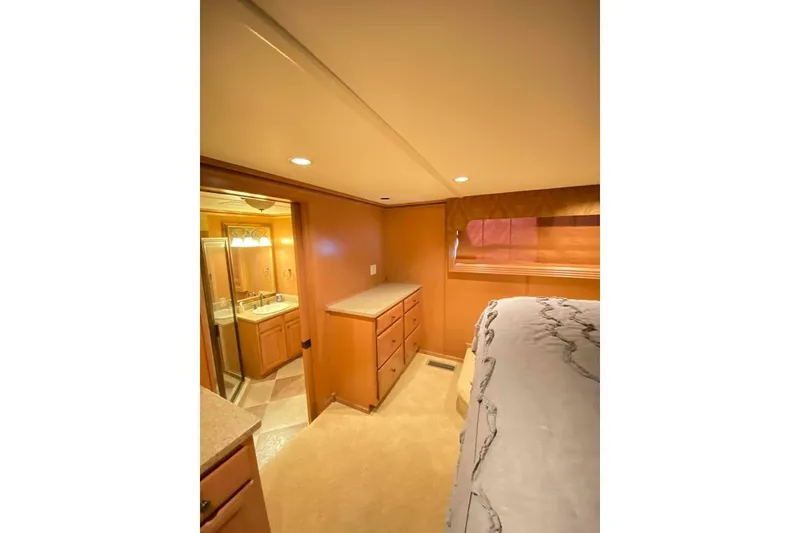 Slide: The Image of Wooden cabinet drawers with granite countertop in a 2007 Summerset 21' x 106' model. - 288