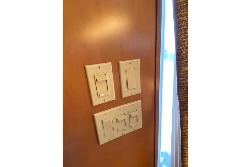 Slide: The Image of Interior of 2007 Summerset houseboat with TV, countertop, and bathroom view. - 294