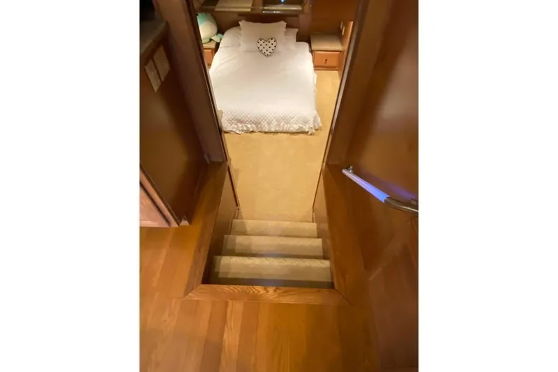 Slide: The Image of Interior of 2007 Summerset model, featuring wooden cabinetry and decorative wall display. - 298