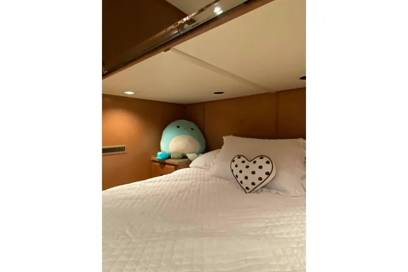 Slide: The Image of Cozy bedroom interior in 2007 Summerset houseboat, featuring wood paneling and soft lighting. - 300