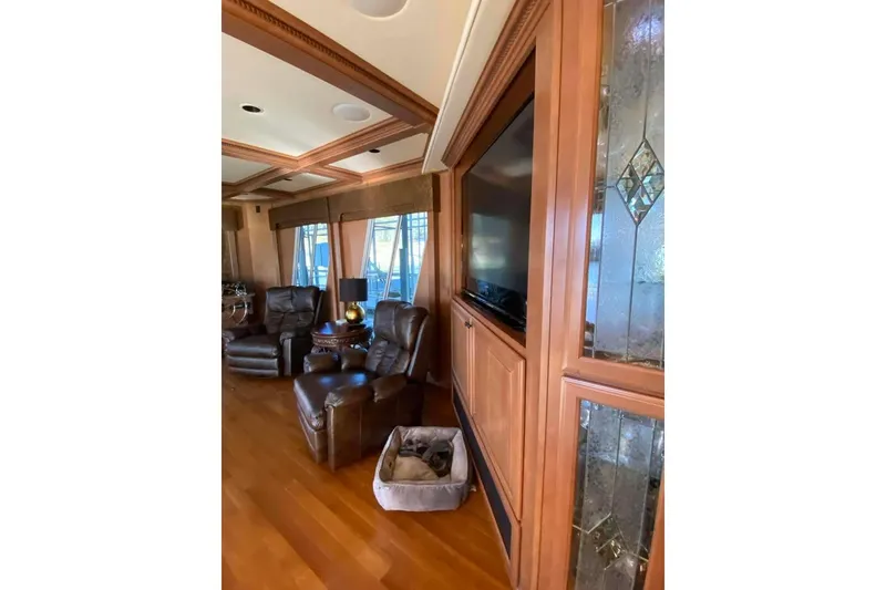 Slide: The Image of Cozy cabin interior of 2007 Summerset houseboat with plush toy and wooden finish. - 305