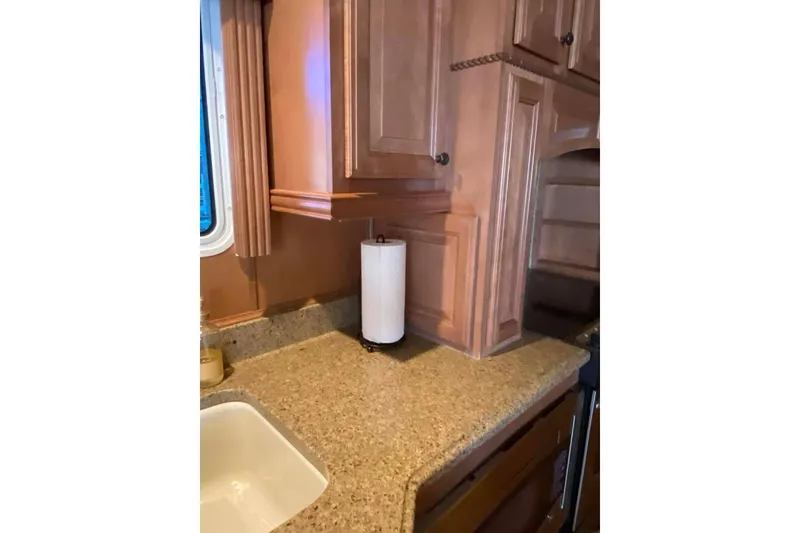 Slide: The Image of Luxurious interior of 2007 Summerset houseboat with leather seating and elegant wood paneling. - 308