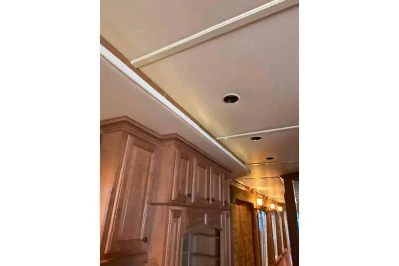 Slide: The Image of Luxurious wooden bar area with wine rack in 2007 Summerset 21' x 106' model. - 310