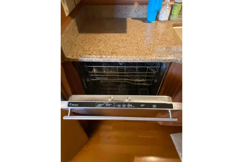 Slide: The Image of Modern kitchen with open oven and wooden cabinetry in 2007 Summerset model. - 315