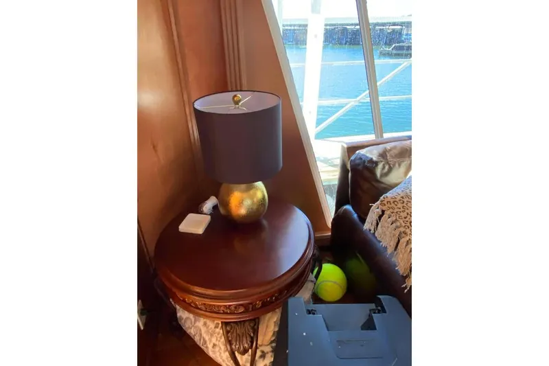 Slide: The Image of Luxurious dining area in 2007 Summerset houseboat, featuring elegant lighting and modern decor. - 322