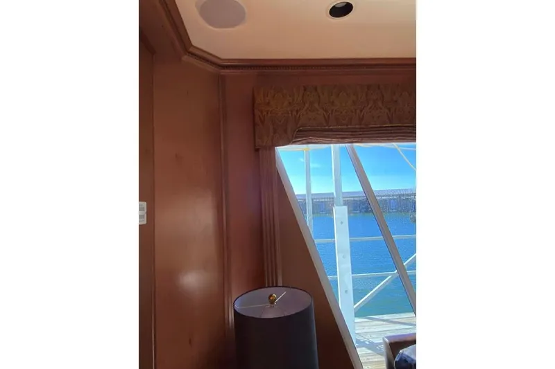 Slide: The Image of Interior view of a 2007 Summerset 21' x 106' model, featuring elegant wood cabinetry and lighting. - 324