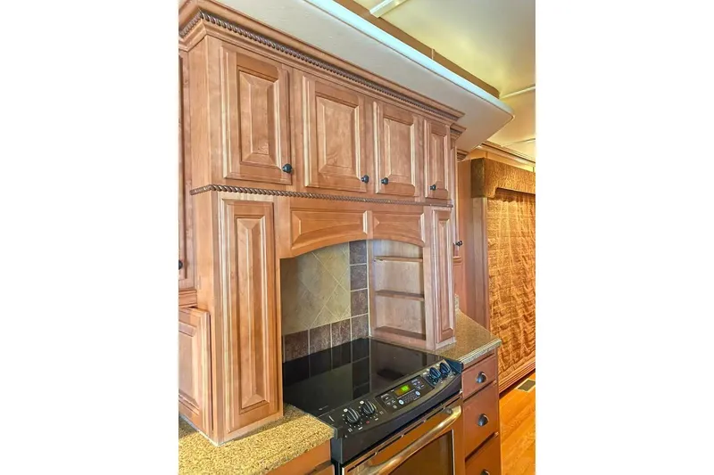 Slide: The Image of Luxurious kitchen in 2007 Summerset houseboat with wooden cabinets and modern appliances. - 33