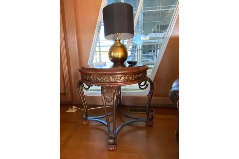 Slide: The Image of Interior of 2007 Summerset houseboat with cozy seating, lamp, and water view. - 335