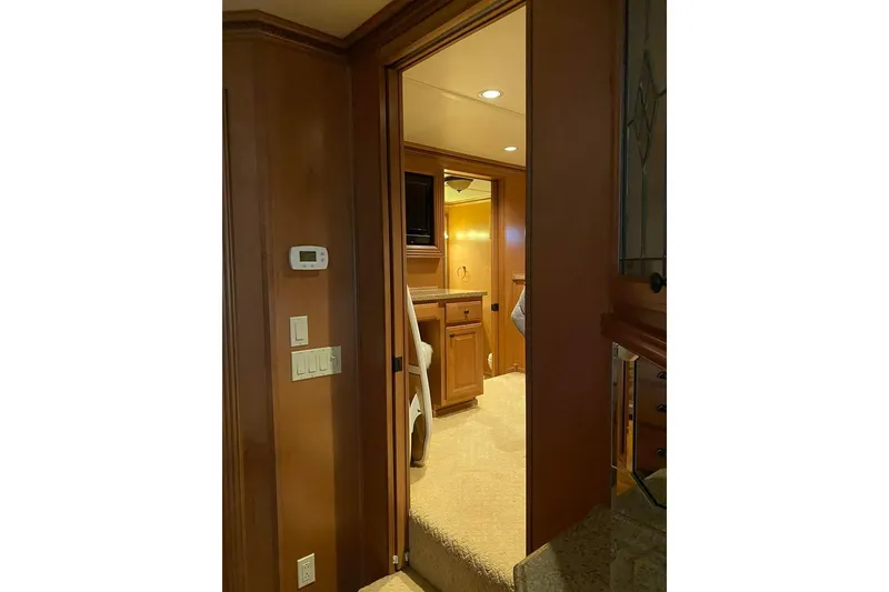 Slide: The Image of Luxurious kitchen in 2007 Summerset houseboat with stainless steel appliances and wooden cabinetry. - 34