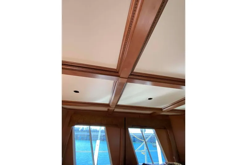 Slide: The Image of Luxurious Summerset 2007 interior with leather chairs, elegant table, and modern window view. - 341