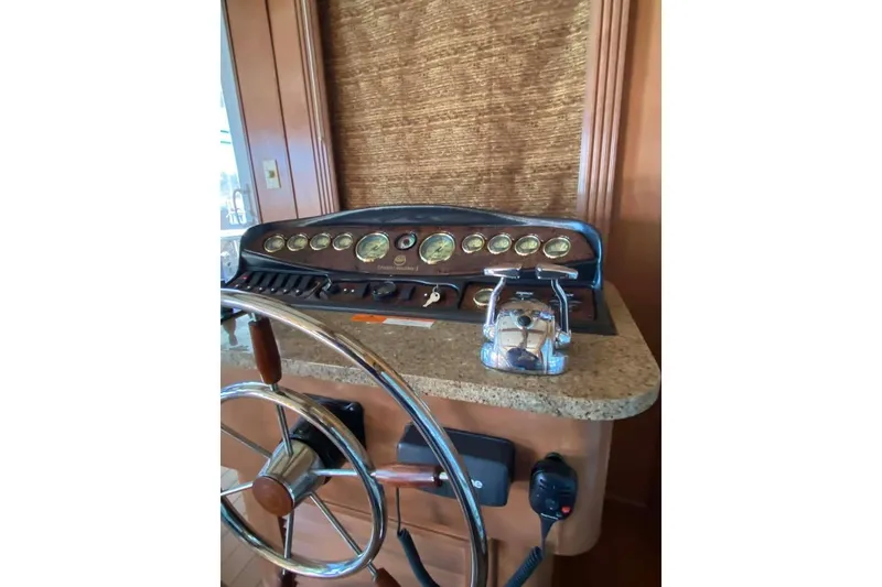 Slide: The Image of Luxurious interior of 2007 Summerset houseboat with leather seating and elegant wood paneling. - 342