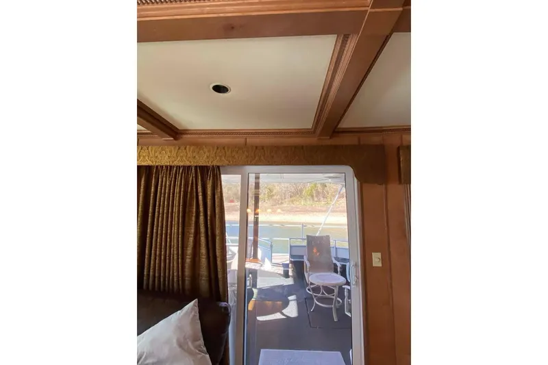 Slide: The Image of Luxurious interior of 2007 Summerset houseboat with leather sofa and sliding glass door. - 348