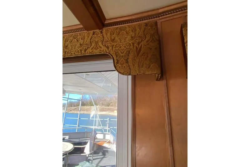 Slide: The Image of Interior view of 2007 Summerset houseboat with sliding glass door and outdoor seating. - 351