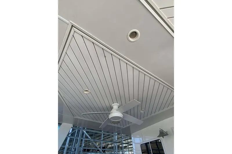 Slide: The Image of Luxurious interior of 2007 Summerset houseboat with leather seating and elegant wood paneling. - 352