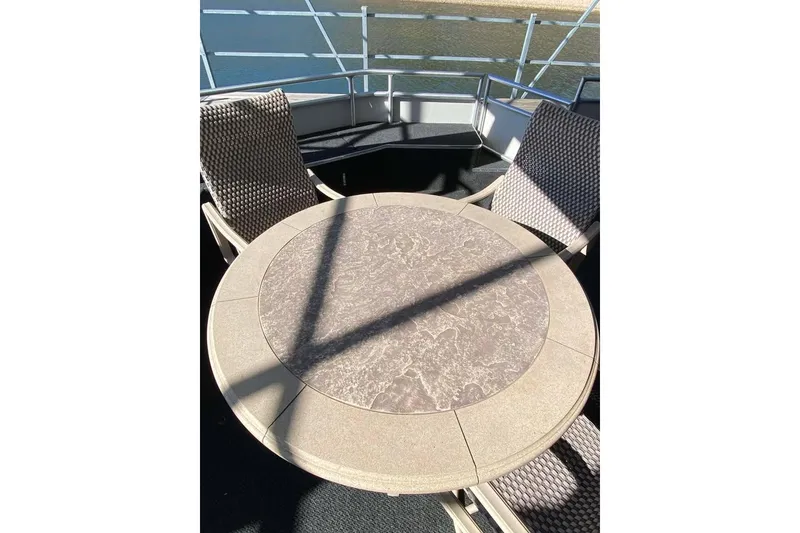 Slide: The Image of 2007 Summerset houseboat interior with sliding glass doors and outdoor seating area. - 358